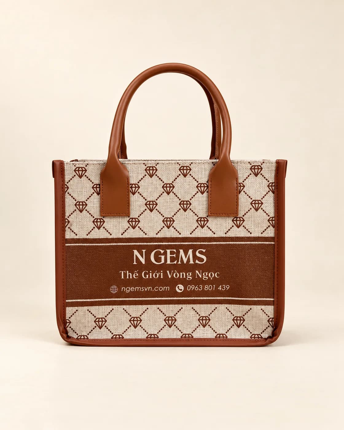 Túi canvas in họa tiết monogram viền và quai da nâu, chữ N Gems